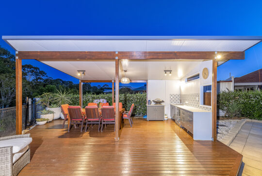 Outdoor entertaining area in pool yard