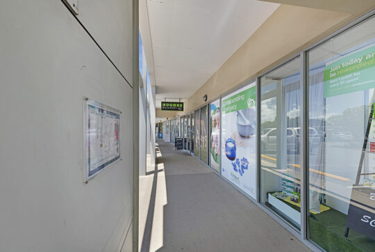 Footpath along the front of the shops at Northway Plaza Shopping Centre