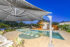 Overlooking the pool area of 4 Melcer Ct to the outdoor entertaining area