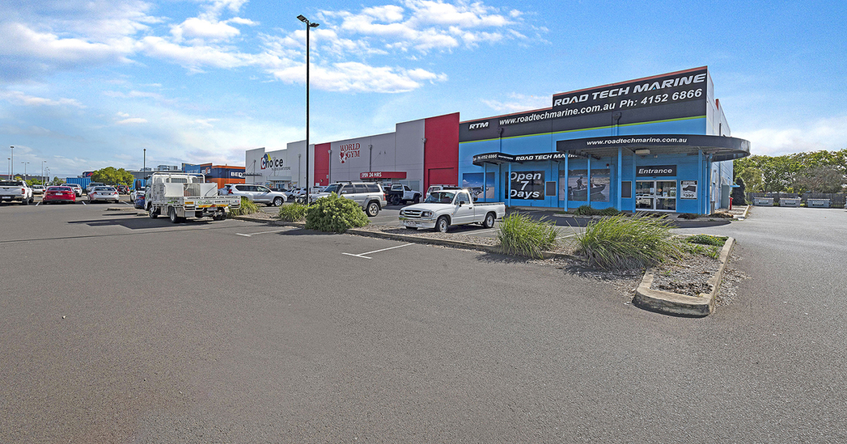 Looking at the commercial complex of Sam's Warehouse building from the carpark