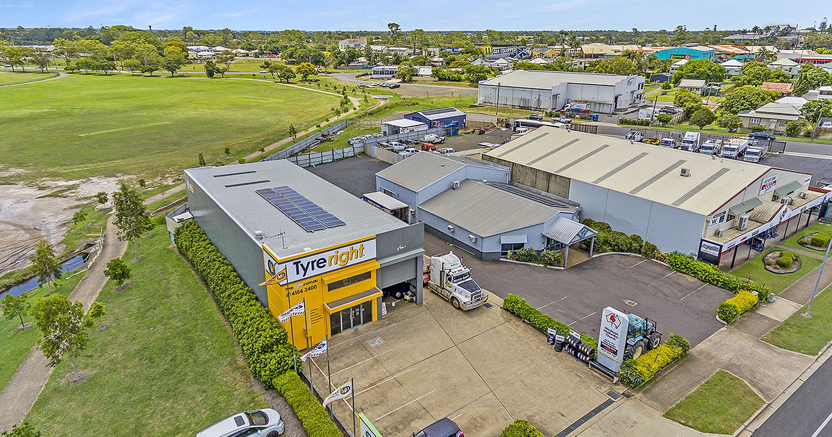 Aerial view of concrete Tyreright building by WK Projects
